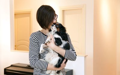 Woman with dog at home