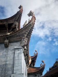 Low angle view of statue against building