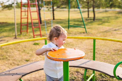 Cute boy standing on playground