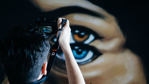 High angle view portrait of woman photographing