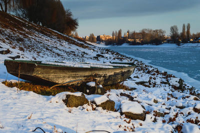 Snow covered landscape against sky