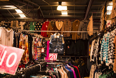 Clothes hanging in store for sale at market