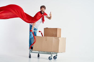 Full length of young man against white background