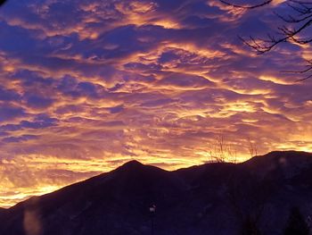 Low angle view of silhouette mountain against sky during sunset