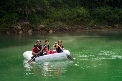 People on boat in lake