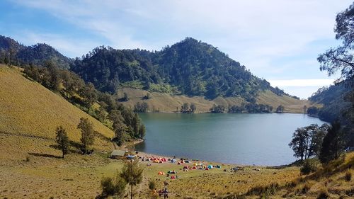 Scenic view of lake and mountains against sky