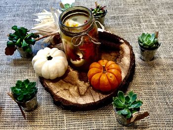 Close-up of various flowers in jar on table