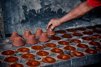 Cropped image of person preparing food