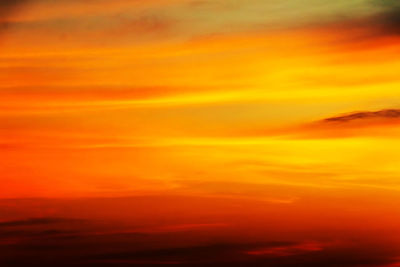 Low angle view of dramatic sky during sunset