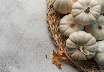 Thanksgiving or harvest flatlay with pumpkins on grey concrete background. autumn fall concept.