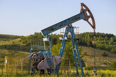 Working oil pump from oil field. industrial equipment. bashkortostan, russia - 12 june, 2021.