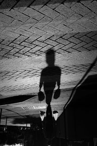 High angle view of man walking on street