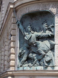 Low angle view of statue on building