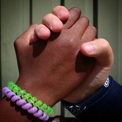 Close-up of african american and a white hand joined together 