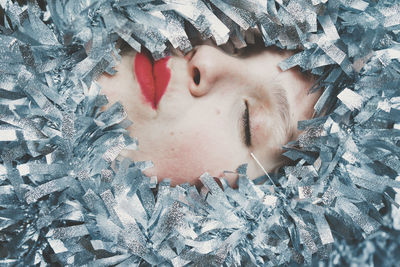 Close-up portrait of woman covered with snow