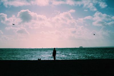 Scenic view of sea against cloudy sky