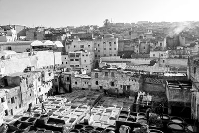 High angle view of old buildings in city against sky