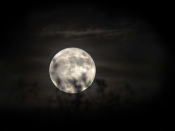 Low angle view of moon against sky at night