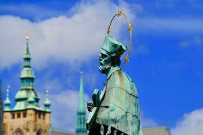 Low angle view of statue against blue sky