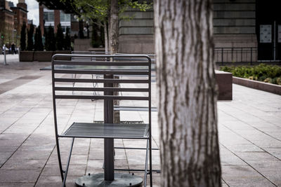 Empty chairs against building