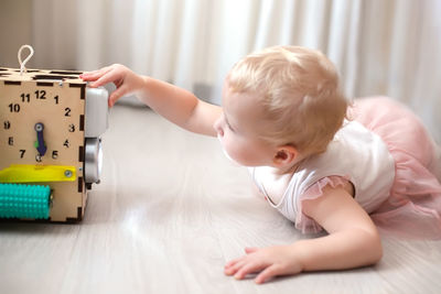 Portrait of cute baby boy sleeping on bed at home