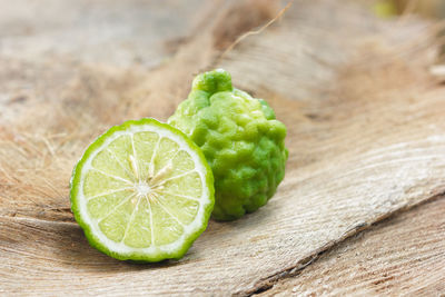 High angle view of green lemon on table