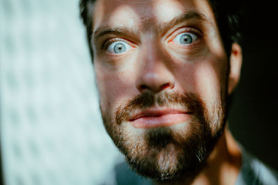 Close-up portrait of serious mid adult man