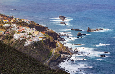 High angle view of buildings by sea