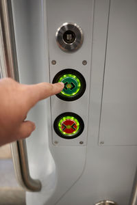 Cropped hand of man using mobile phone