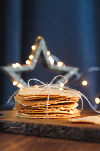 Close-up of wafer with illuminated star shape on table