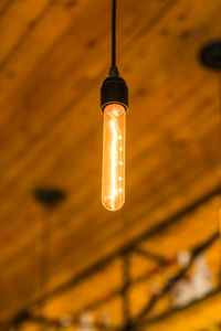 Low angle view of illuminated light bulb