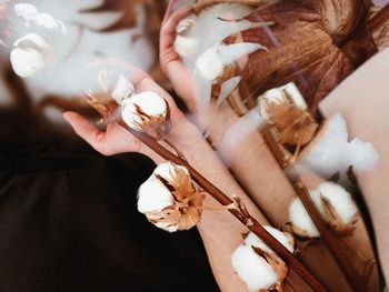 High angle view of hands on white wall