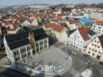 High angle view of houses in town against sky