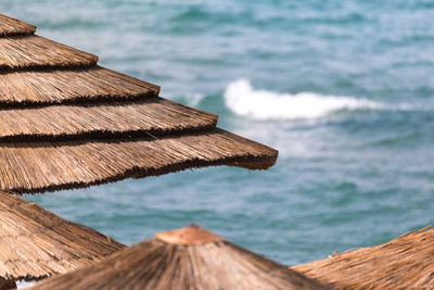 Close-up of pier against sea