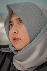 Close-up of young woman in hijab