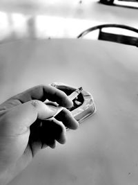 Close-up of hand holding umbrella