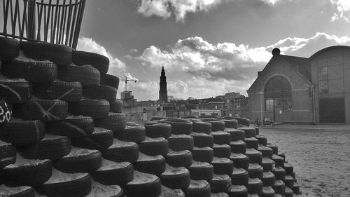 Buildings against cloudy sky