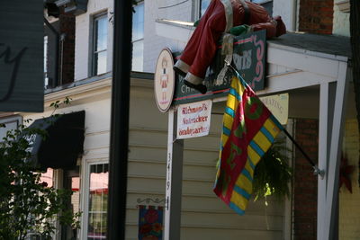 Low angle view of flags hanging on building