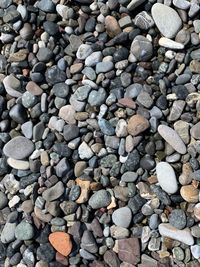 High angle view of stones on pebbles
