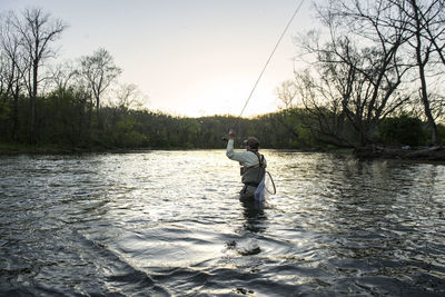 Flyfishing at sunset during a caddis emergence