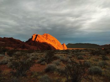 Rock formations on landscape against sky