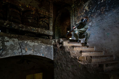 Low angle view of man walking in cave