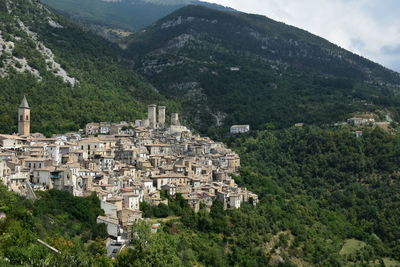 High angle view of townscape and mountains