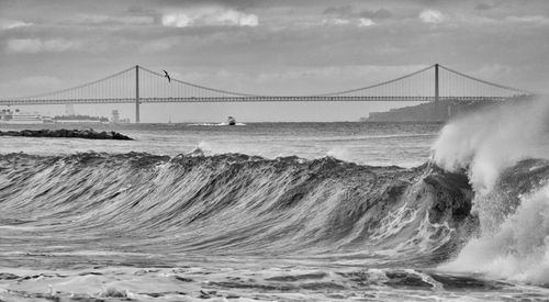 View of suspension bridge over sea