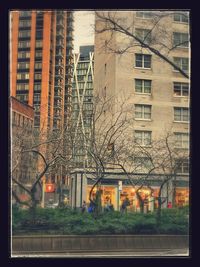 Buildings by street in city