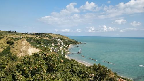 High angle view of beach and sea against sky