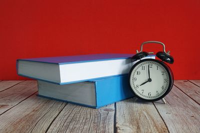 Close-up of clock on table