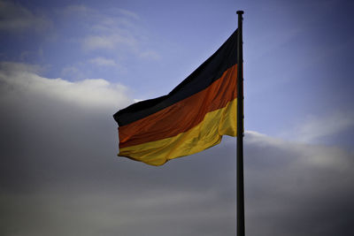 Low angle view of flag against sky