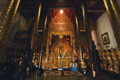 Low angle view of illuminated temple in building