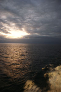 Scenic view of sea against cloudy sky